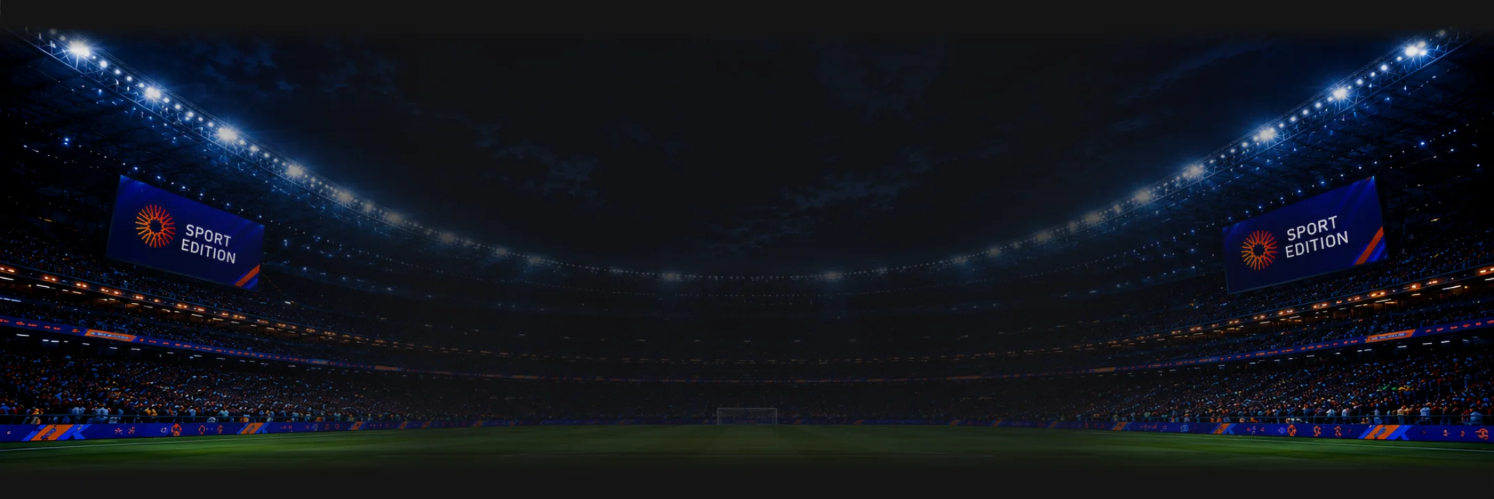 Floodlit football stadium at night with b2b-alive Sport LED screens in the stands